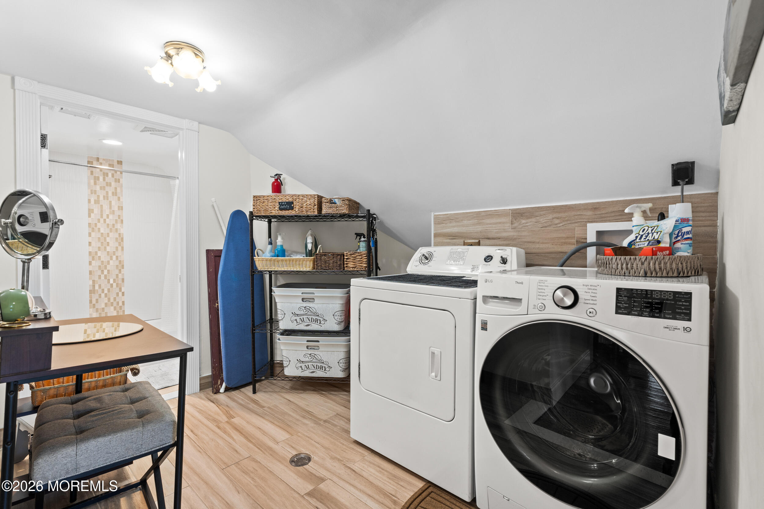 75 Webb Avenue, Unit UPPER WEEKLY Ocean Grove, NJ 07756 - Photo 25 of 41 a view of livingroom with washer and dryer