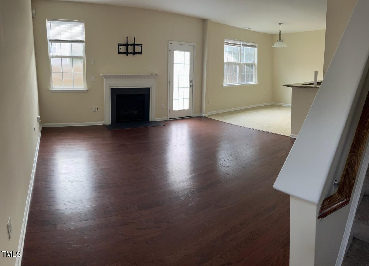 3622 Brideveil Court Raleigh, NC 27610 - Photo 3 of 12 an empty room with windows and fireplace