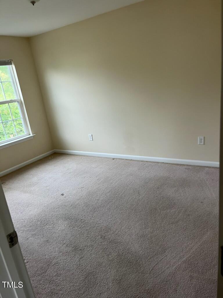 3622 Brideveil Court Raleigh, NC 27610 - Photo 9 of 12 a view of an empty room with a window