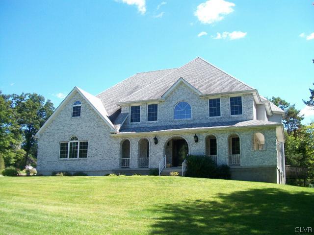 548 Quail Ridge Lane Stroudsburg, PA 18360 - Photo 1 of 24 a front view of a house with a yard