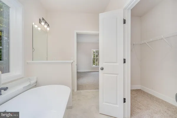 a bathroom with a glass shower door
