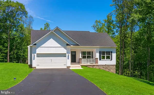 a view of house with yard and entertaining space