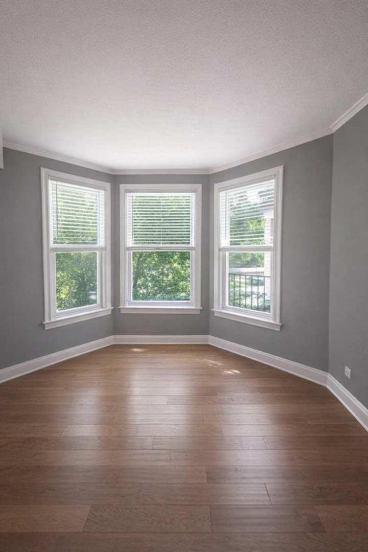5320 South Carpenter Street Chicago, IL 60609 - Photo 2 of 5 a view of empty room with wooden floor and fan
