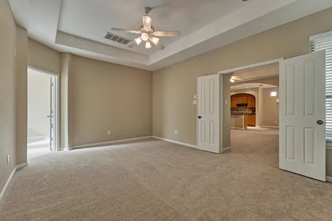a bathroom with a tub shower vanity and a sink