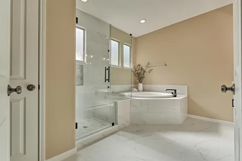 a bathroom with double sink and a mirror
