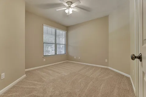 a backyard of a house with yard and outdoor seating