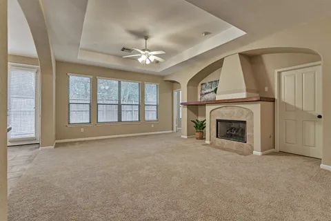 a view of a kitchen with a sink and a fireplace