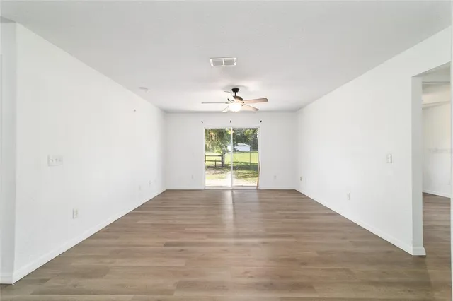 a view of kitchen with cabinets and wooden floor