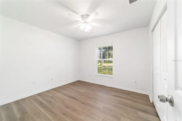an aerial view of residential houses with yard