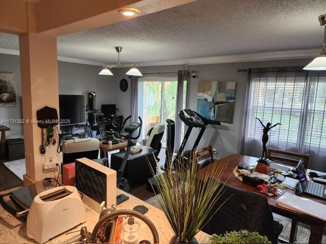 17911 Northwest 68th Avenue, Unit M104 Hialeah, FL 33015 - Photo 11 of 16 a view of a room with gym equipment