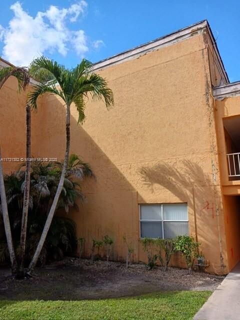 17911 Northwest 68th Avenue, Unit M104 Hialeah, FL 33015 - Photo 15 of 16 a view of a house with a backyard