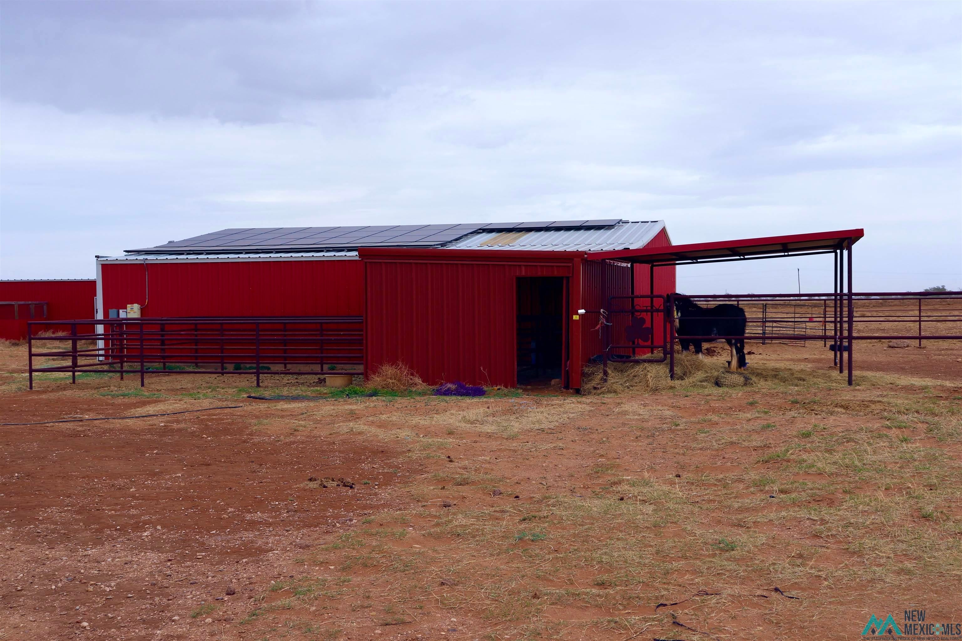845 South Roosevelt Road South Portales, NM 88130 - Photo 36 of 47 View of indoor riding arena with a rural view