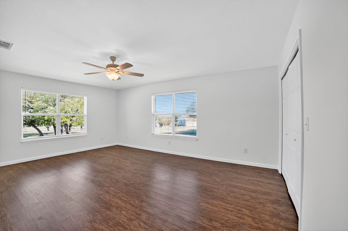 313 Starview Drive Georgetown, TX 78628 - Photo 21 of 38 an empty room with window and wooden floor