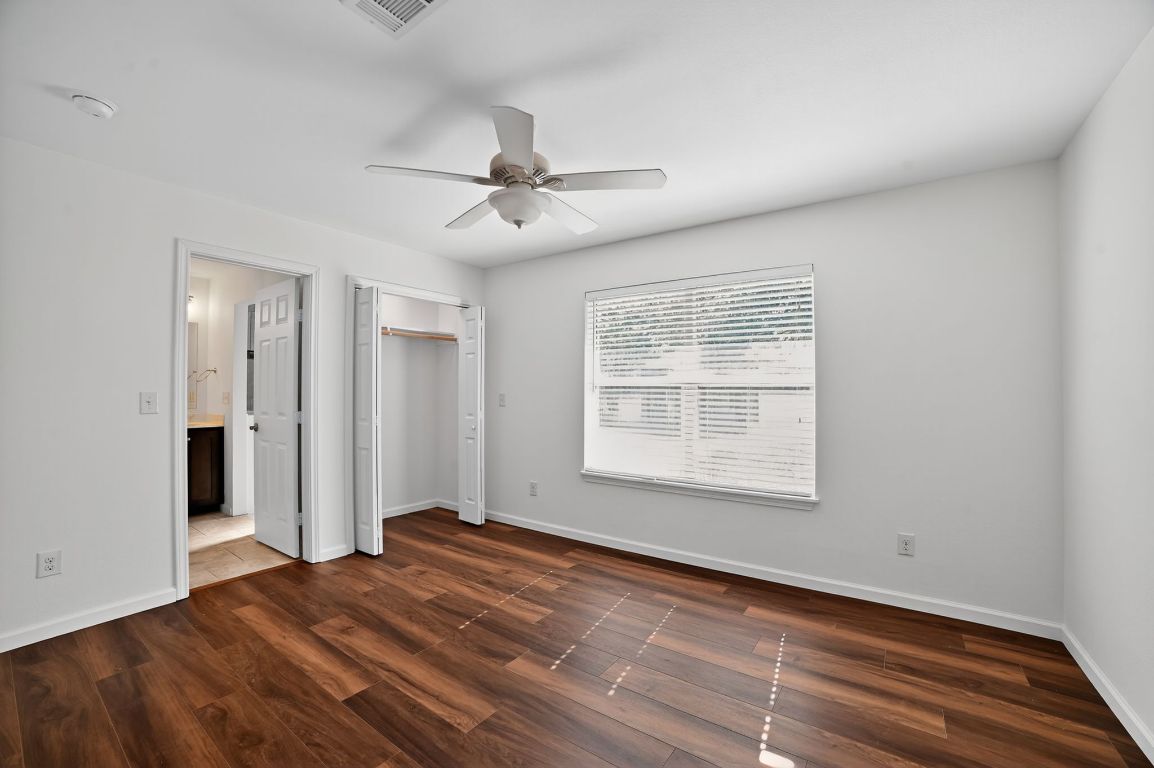 313 Starview Drive Georgetown, TX 78628 - Photo 26 of 38 a view of an empty room with a window and wooden floor