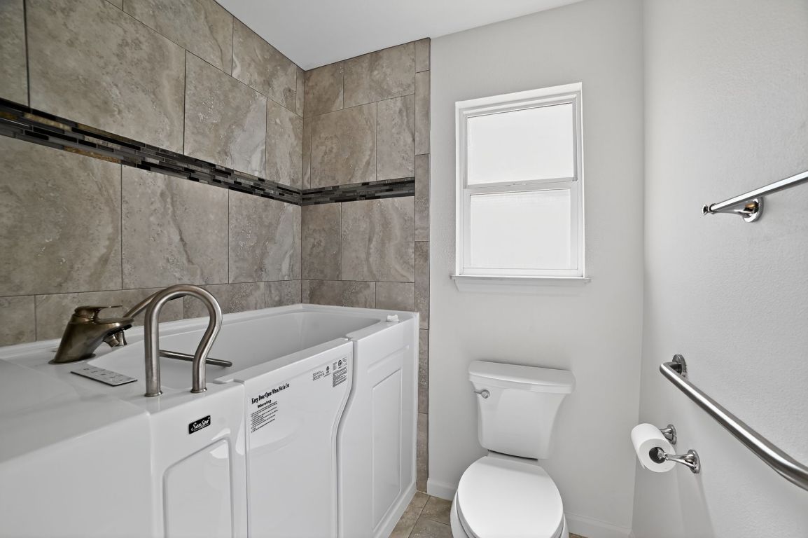 313 Starview Drive Georgetown, TX 78628 - Photo 30 of 38 a bathroom with a sink toilet and vanity