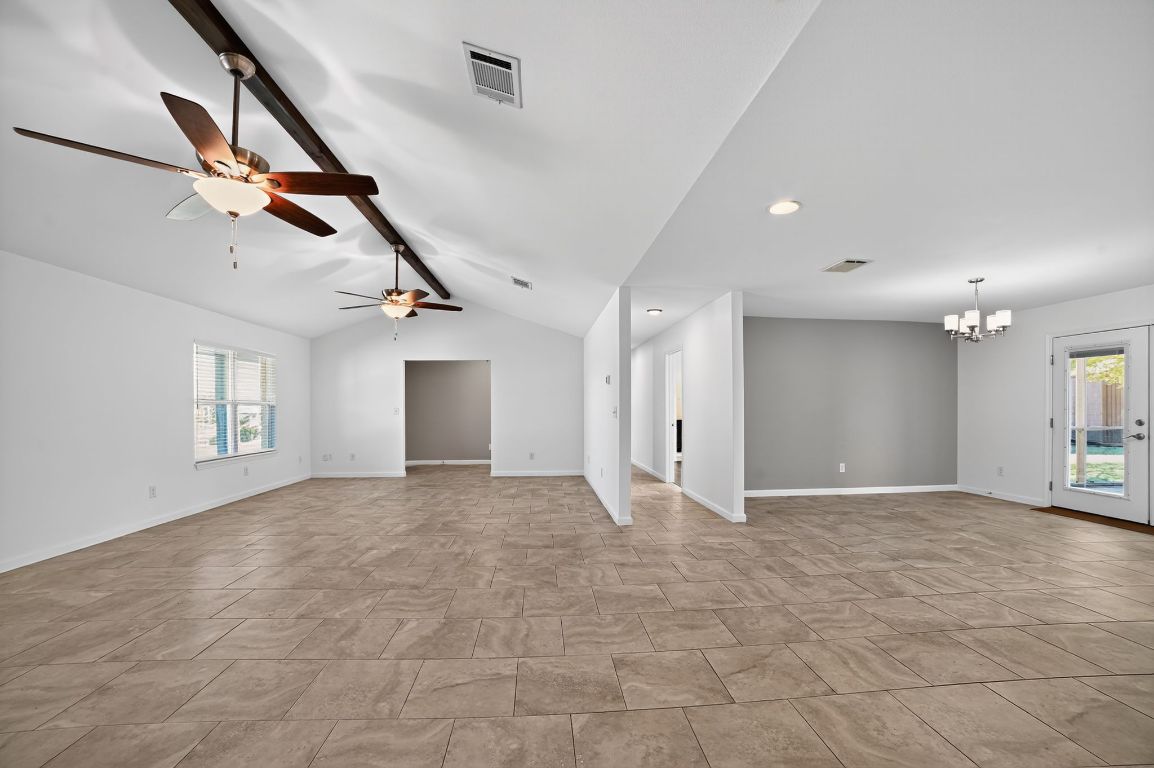 313 Starview Drive Georgetown, TX 78628 - Photo 7 of 38 a view of empty room with wooden floor