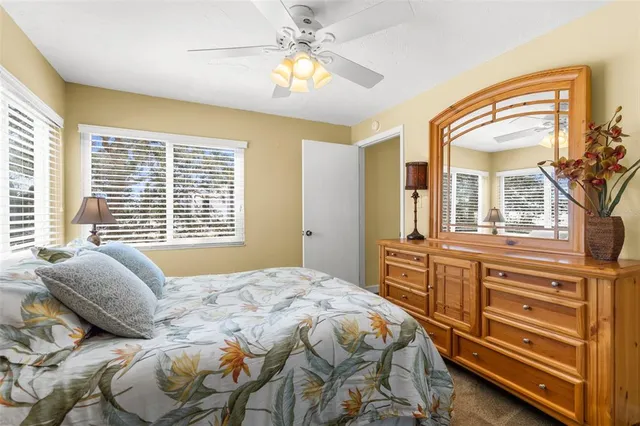 a view of a kitchen with furniture and floor to ceiling window