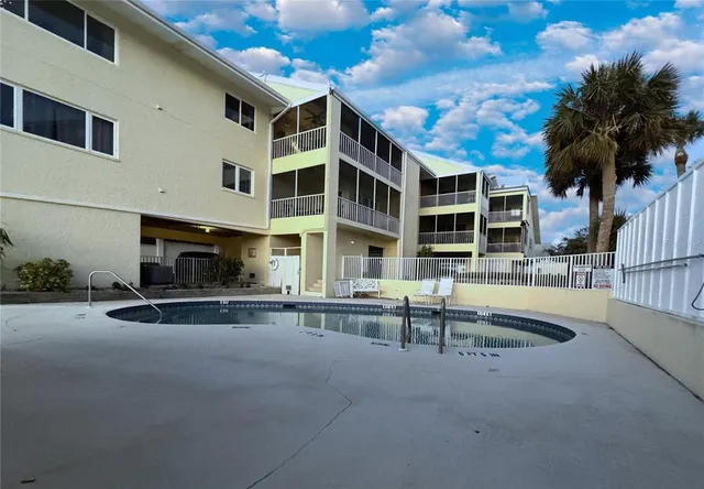 an aerial view of a houses with ocean view