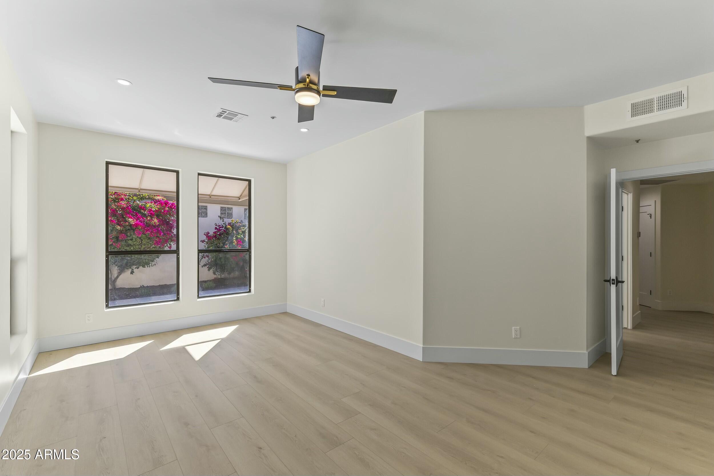 7705 East Doubletree Ranch Road, Unit 21 Scottsdale, AZ 85258 - Photo 20 of 45 a view of an empty room with a window