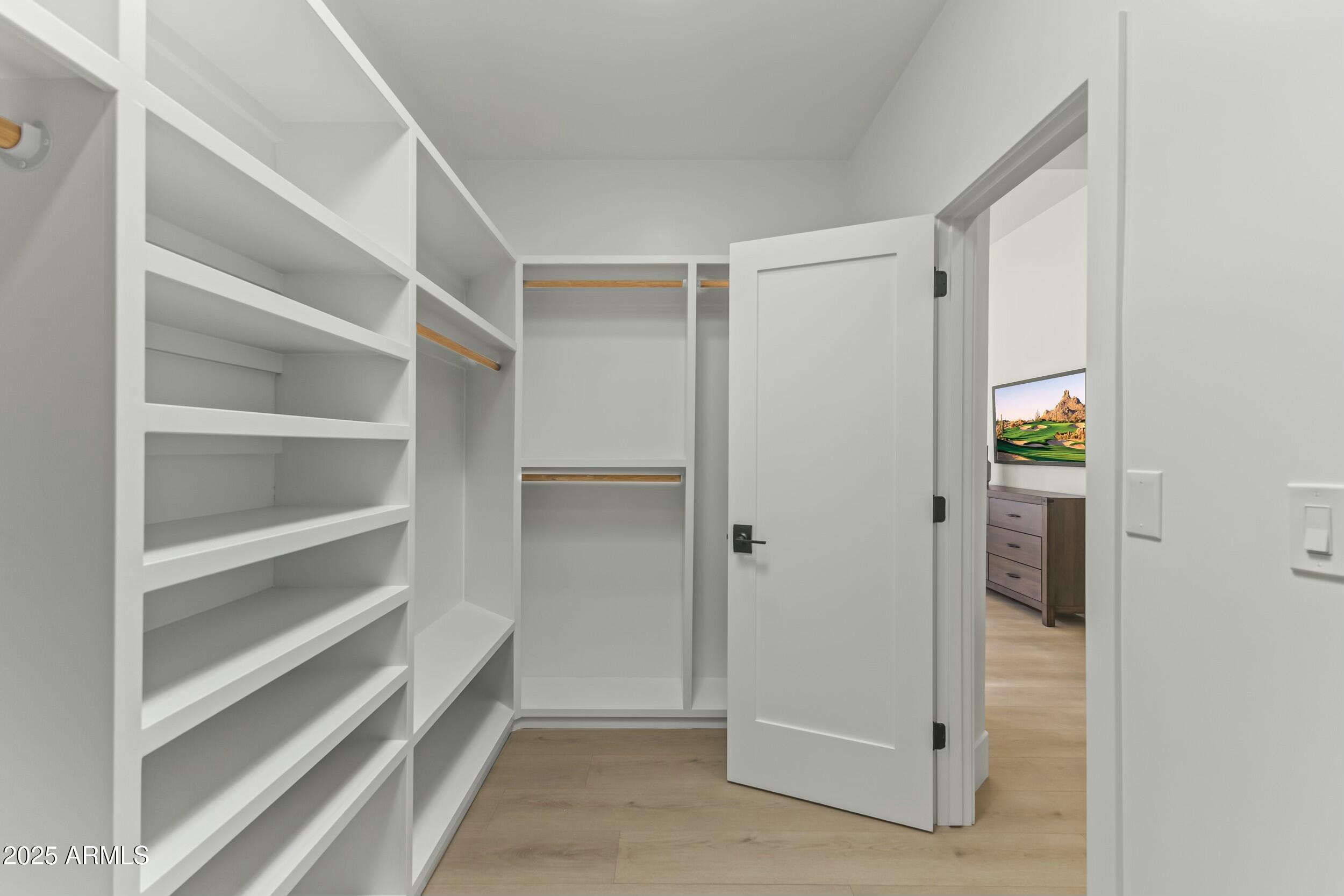 7705 East Doubletree Ranch Road, Unit 21 Scottsdale, AZ 85258 - Photo 24 of 45 a view of an empty walk in closet