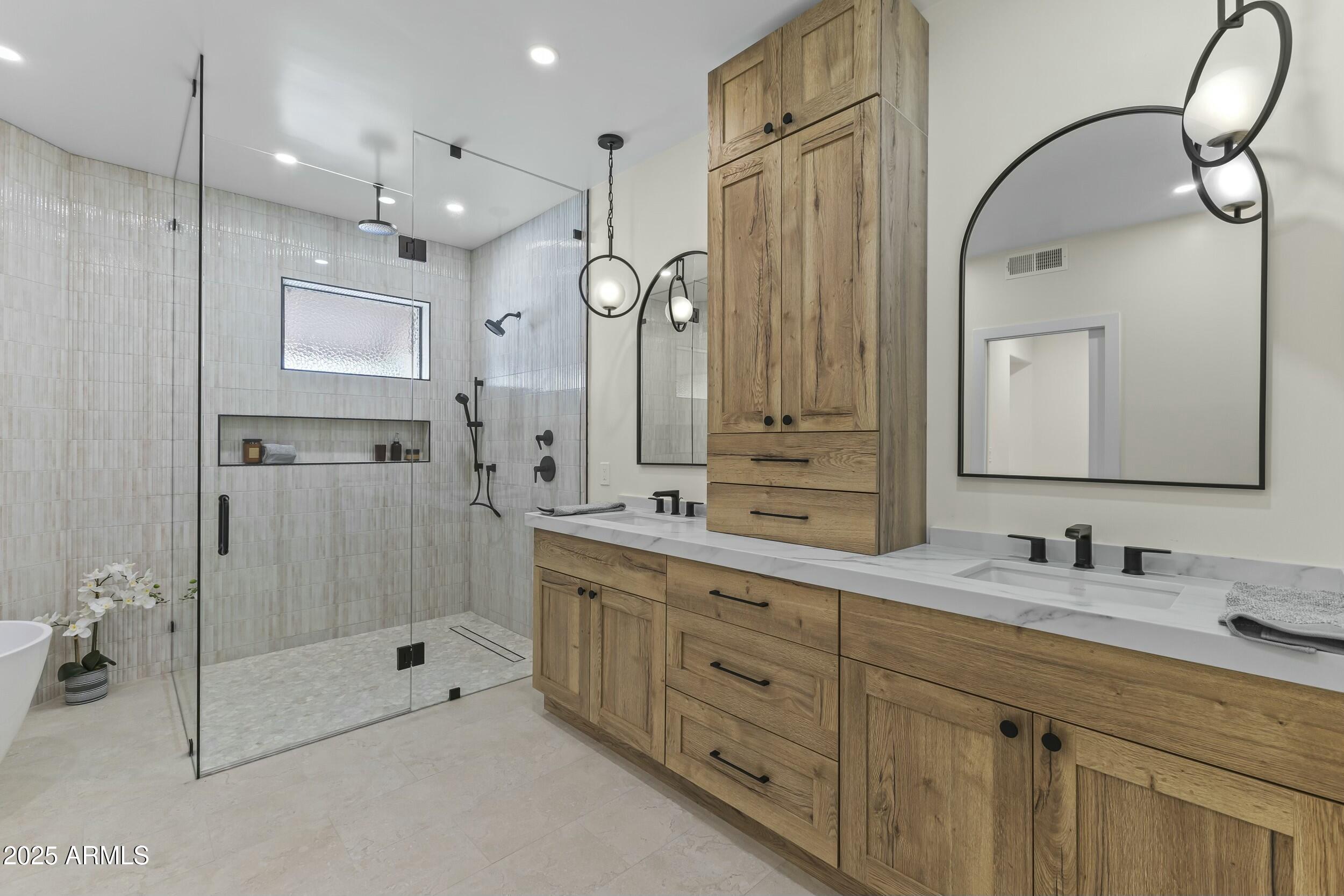7705 East Doubletree Ranch Road, Unit 21 Scottsdale, AZ 85258 - Photo 25 of 45 a bathroom with a double vanity sink mirror double and shower