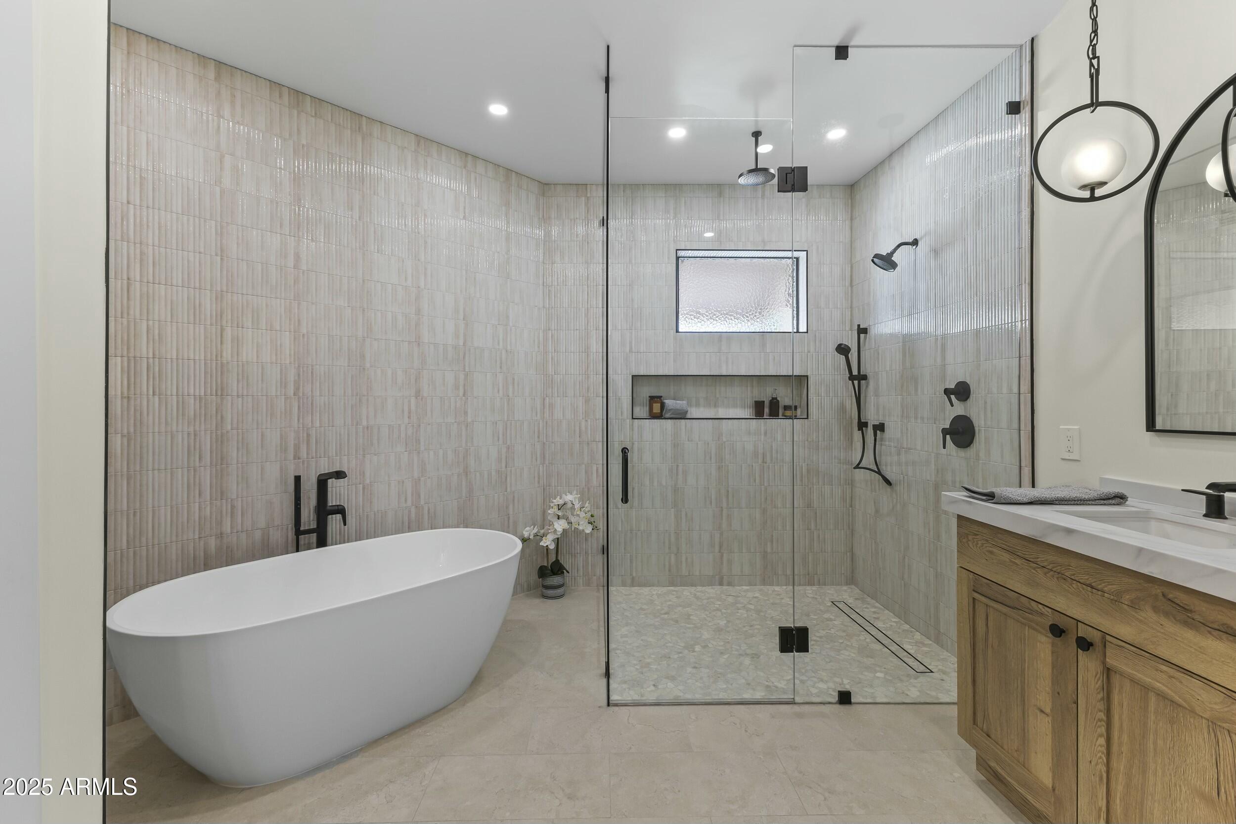 7705 East Doubletree Ranch Road, Unit 21 Scottsdale, AZ 85258 - Photo 26 of 45 a bathroom with a bathtub and a shower