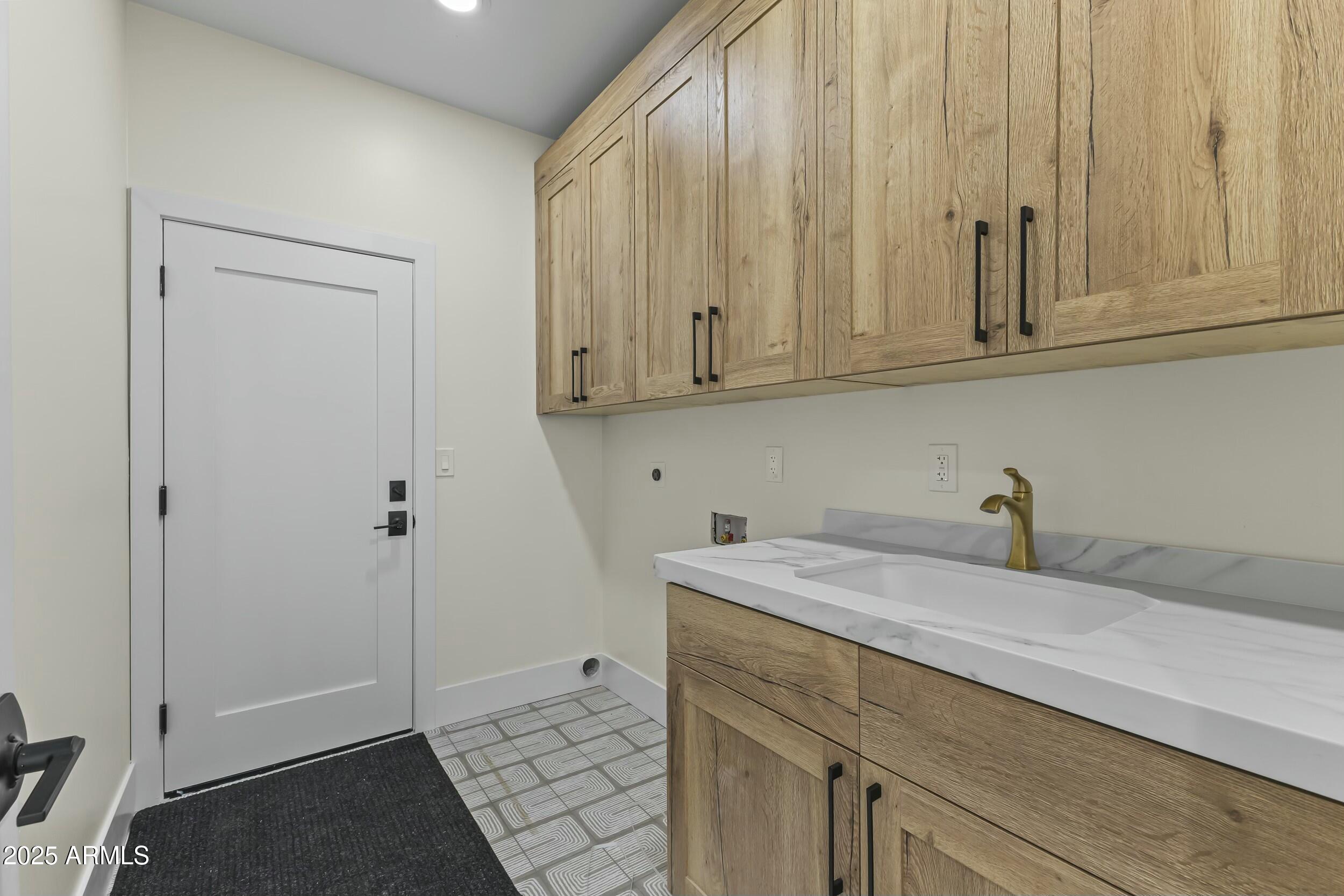 7705 East Doubletree Ranch Road, Unit 21 Scottsdale, AZ 85258 - Photo 28 of 45 a bathroom with a sink and cabinets