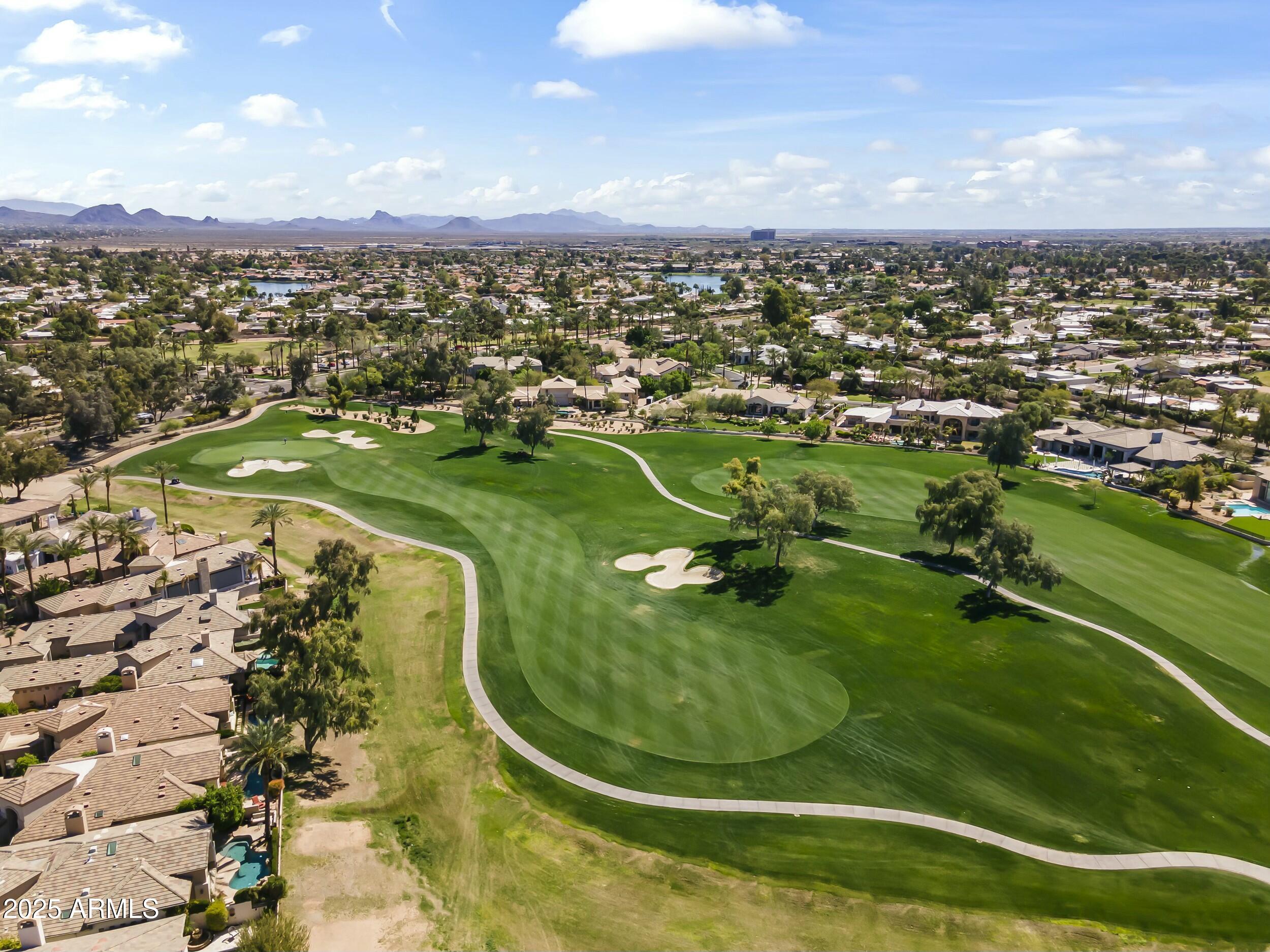 7705 East Doubletree Ranch Road, Unit 21 Scottsdale, AZ 85258 - Photo 41 of 45 an aerial view of a residential houses with outdoor space and trees