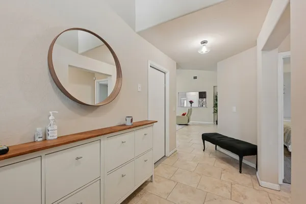 a spacious bathroom with a sink a mirror and a shower