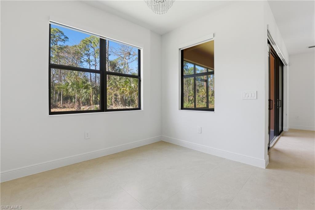 2167 Della Drive Naples, FL 34117 - Photo 13 of 38 Unfurnished room featuring baseboards