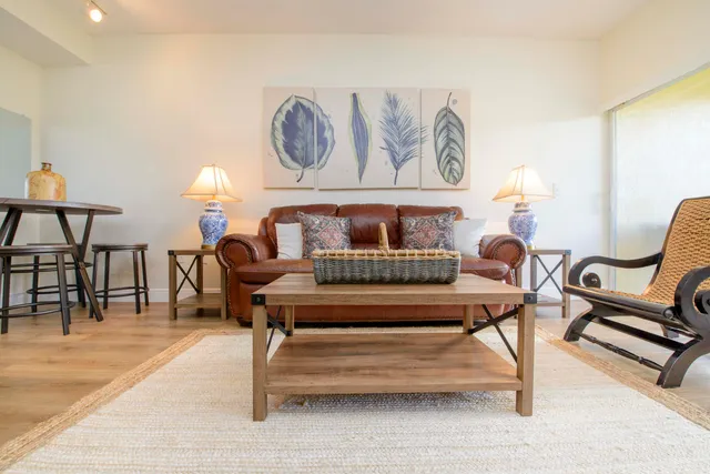 a living room with furniture and a rug