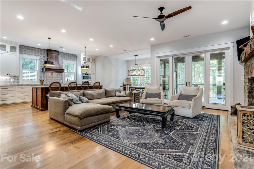 8080 Stillwater Drive Denver, NC 28037 - Photo 11 of 44 a living room with furniture kitchen view and a large window