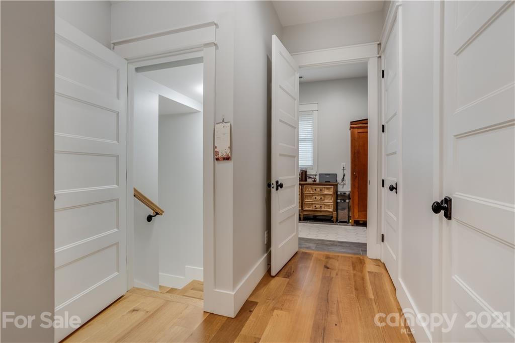 8080 Stillwater Drive Denver, NC 28037 - Photo 12 of 44 a view of a hallway with wooden floor and closet