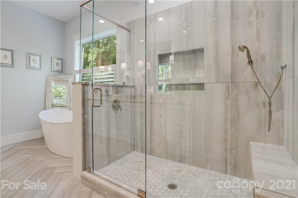 8080 Stillwater Drive Denver, NC 28037 - Photo 19 of 44 a bathroom with a shower and a sink