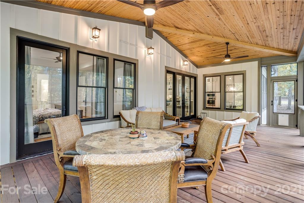 8080 Stillwater Drive Denver, NC 28037 - Photo 34 of 44 a view of a dining room with furniture window and wooden floor