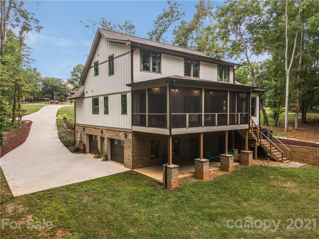 8080 Stillwater Drive Denver, NC 28037 - Photo 37 of 44 a view of a house with a yard and sitting area