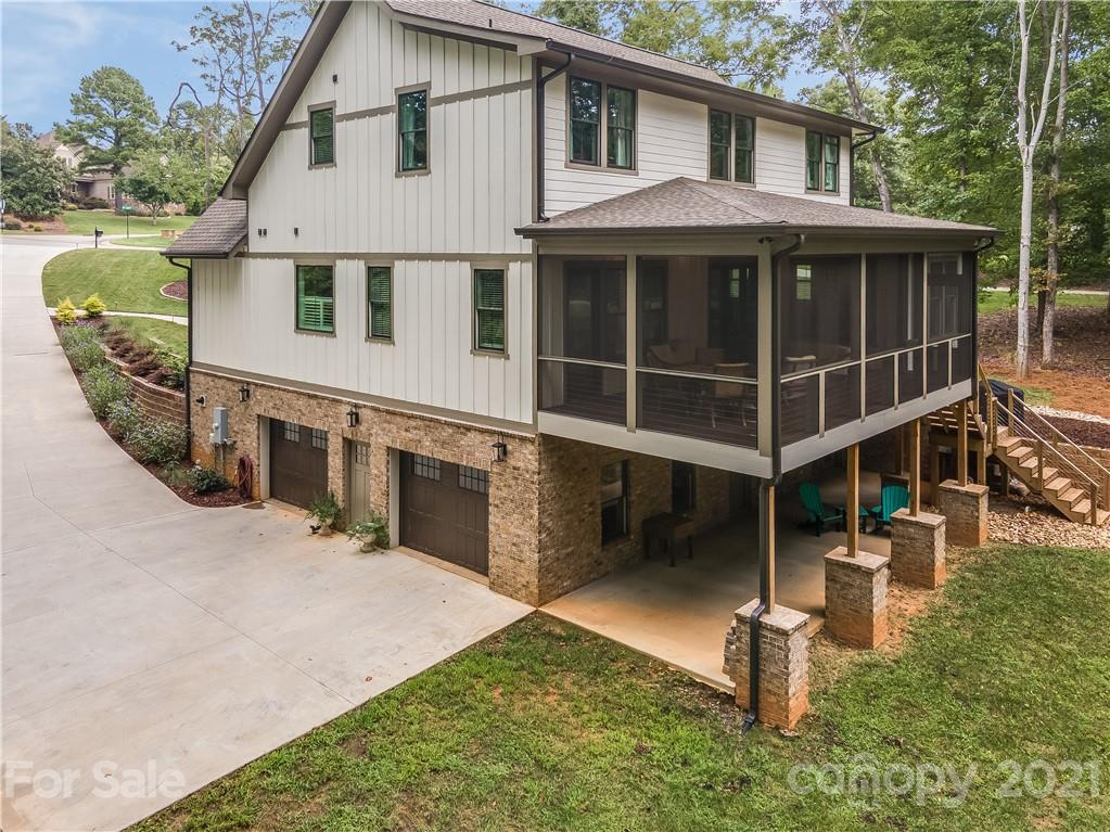 8080 Stillwater Drive Denver, NC 28037 - Photo 38 of 44 a front view of a house with a yard