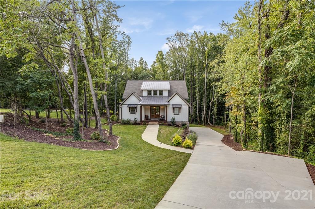8080 Stillwater Drive Denver, NC 28037 - Photo 40 of 44 a front view of a house with a yard
