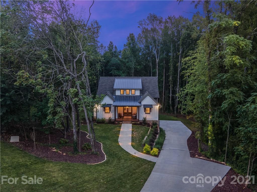 8080 Stillwater Drive Denver, NC 28037 - Photo 44 of 44 a view of a park with a bench and trees