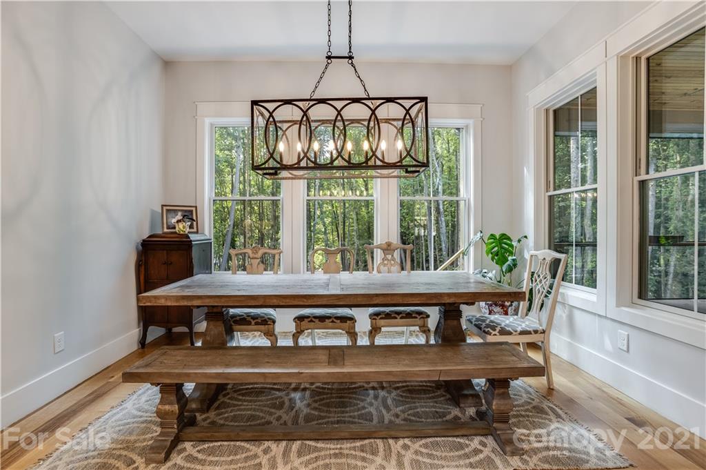 8080 Stillwater Drive Denver, NC 28037 - Photo 6 of 44 a view of a dining room with furniture window and outside view