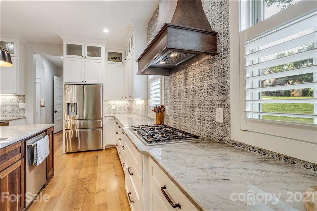 8080 Stillwater Drive Denver, NC 28037 - Photo 7 of 44 a kitchen with stainless steel appliances granite countertop a stove a refrigerator and a stove