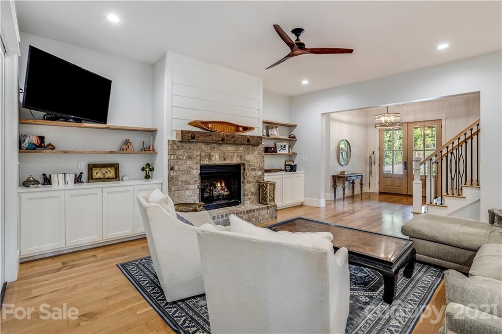 8080 Stillwater Drive Denver, NC 28037 - Photo 10 of 44 a living room with furniture and a flat screen tv