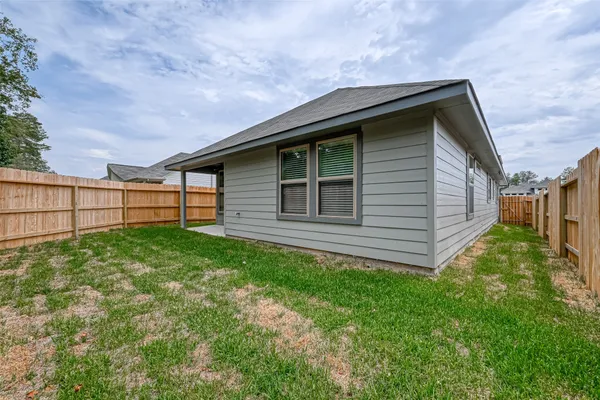 a backyard of a house with lots of green space