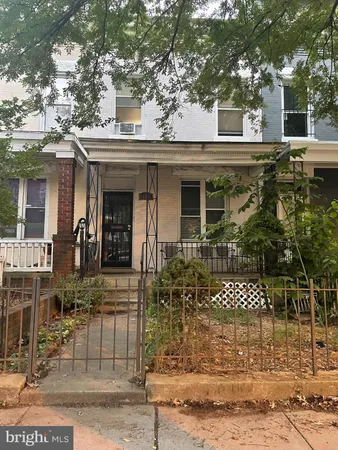 a view of a house with brick walls