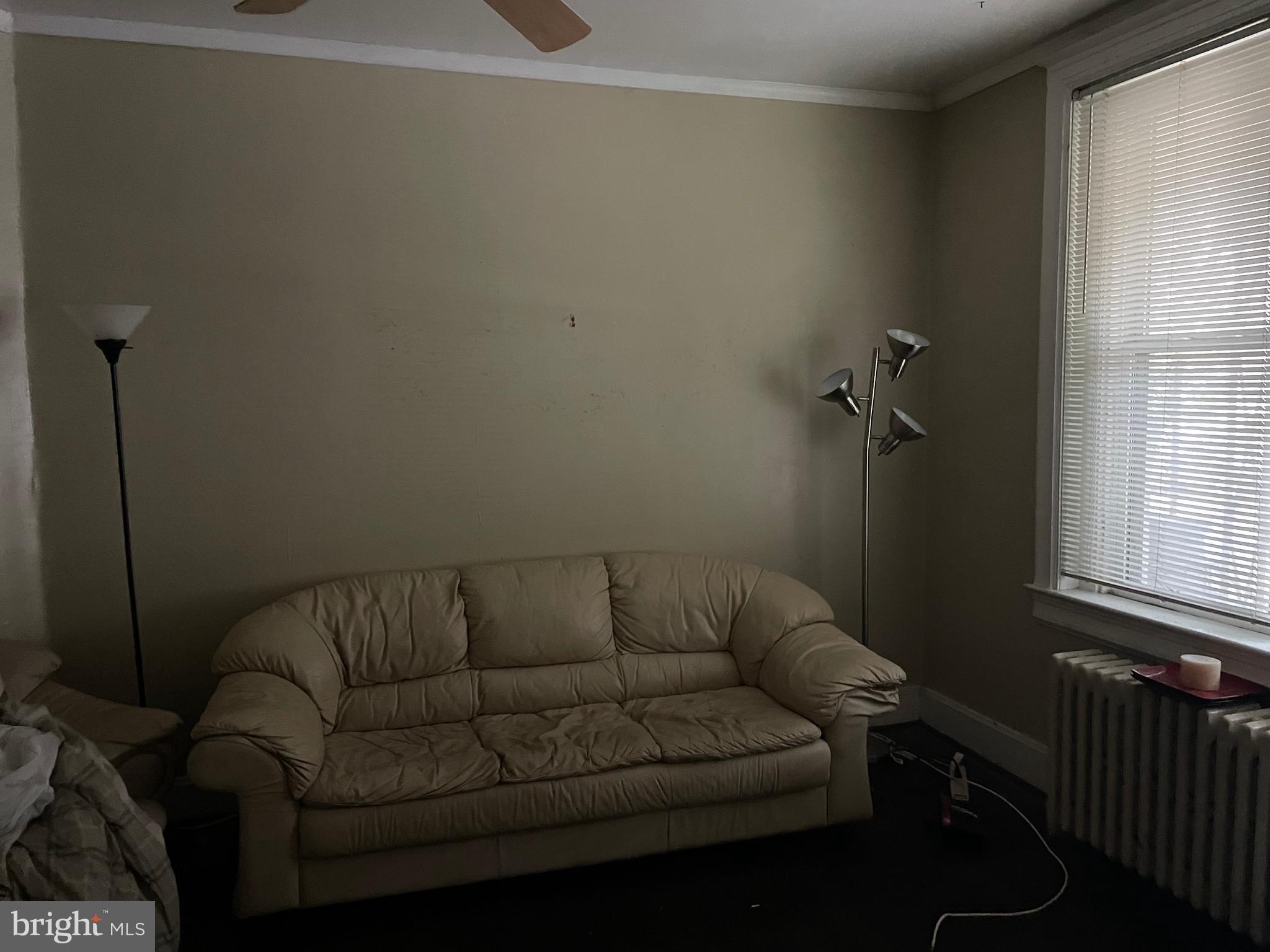 604 Irving Street Northwest Washington, DC 20010 - Photo 2 of 11 a living room with furniture and a window