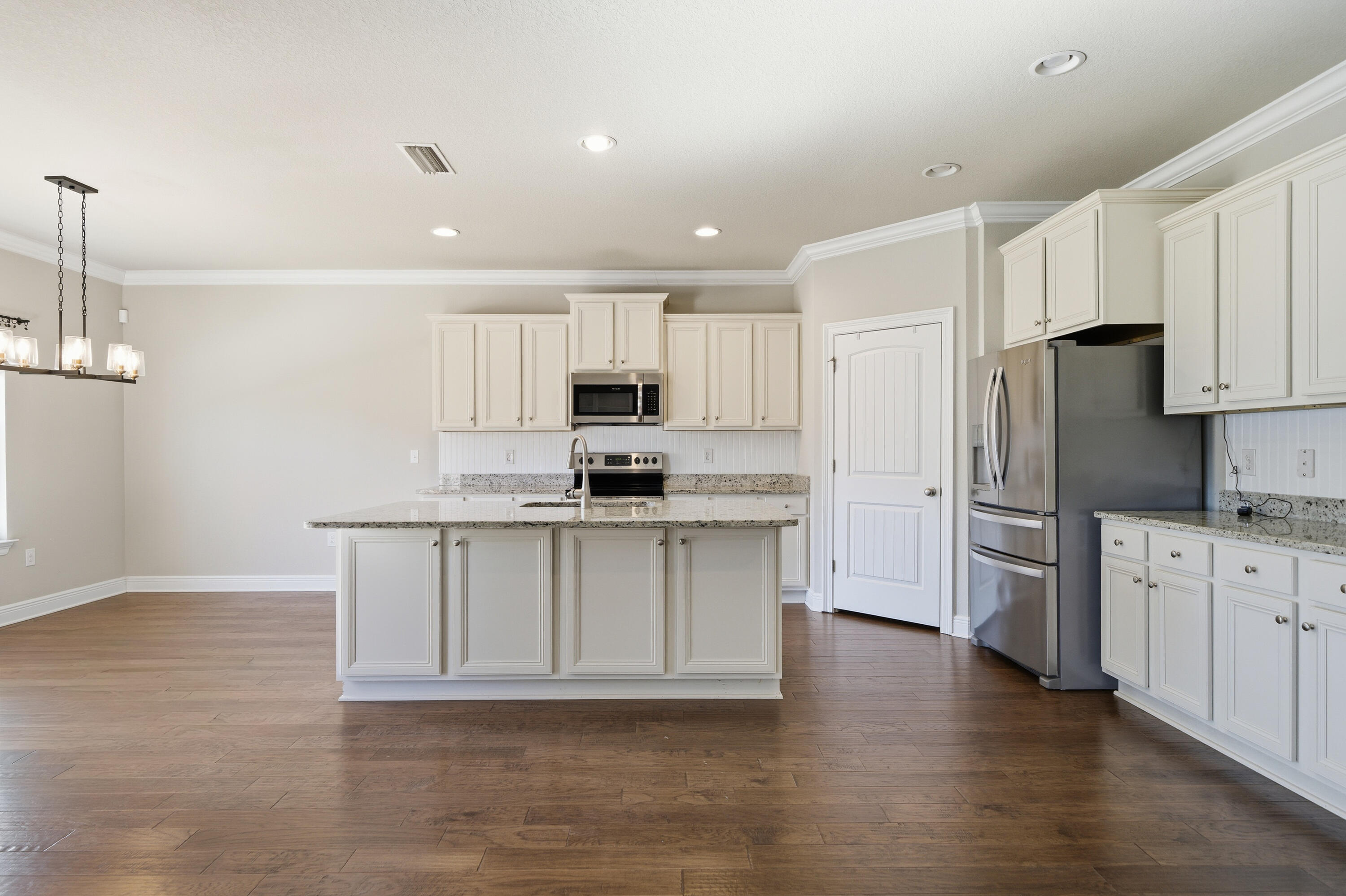 132 Wayne Trail Santa Rosa Beach, FL 32459 - Photo 11 of 43 a kitchen with granite countertop a refrigerator stove top oven and sink