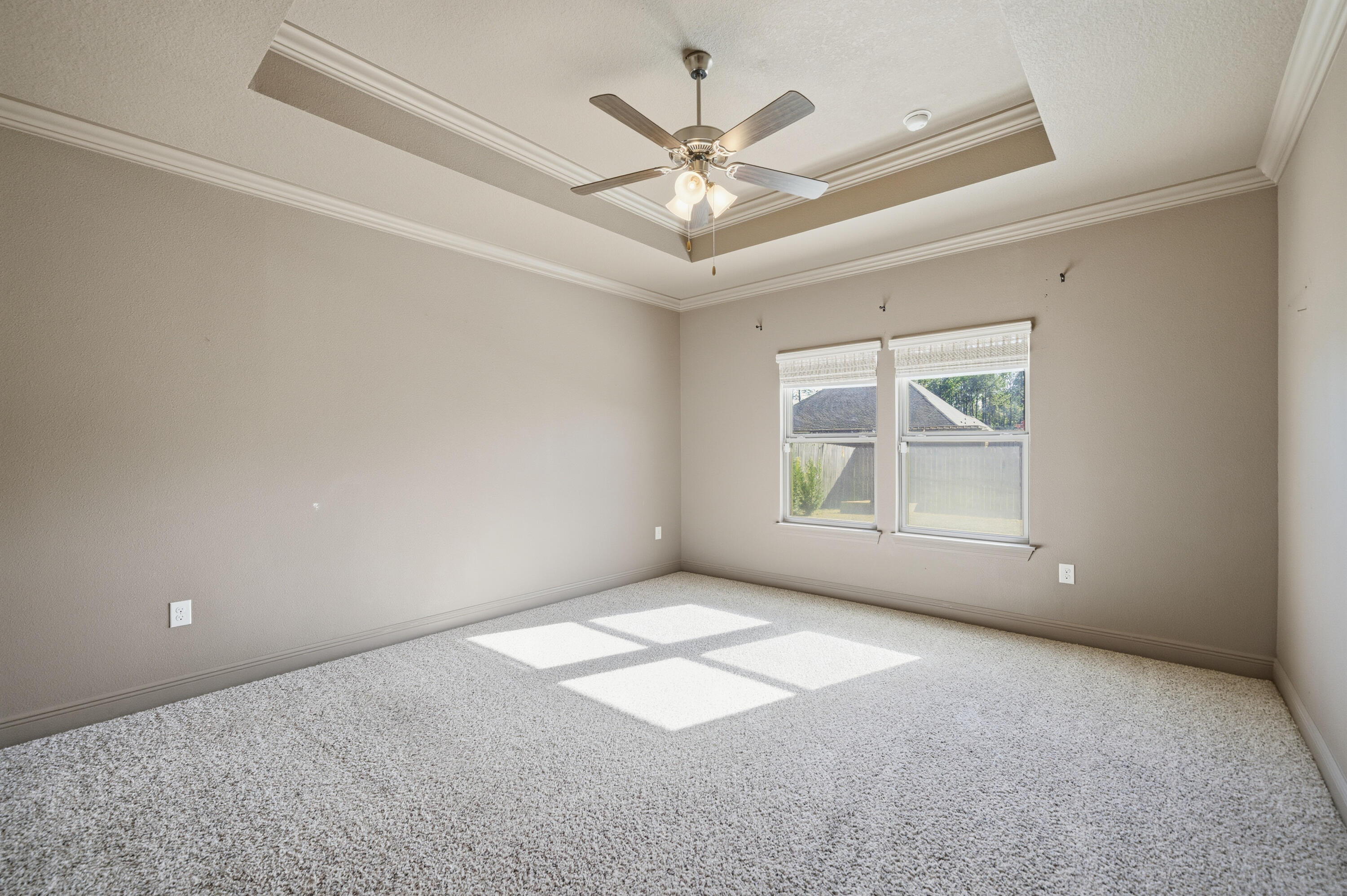 132 Wayne Trail Santa Rosa Beach, FL 32459 - Photo 17 of 43 an empty room with windows and ceiling fan