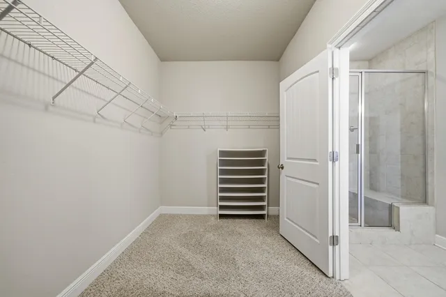 a view of a room with staircase and white walls