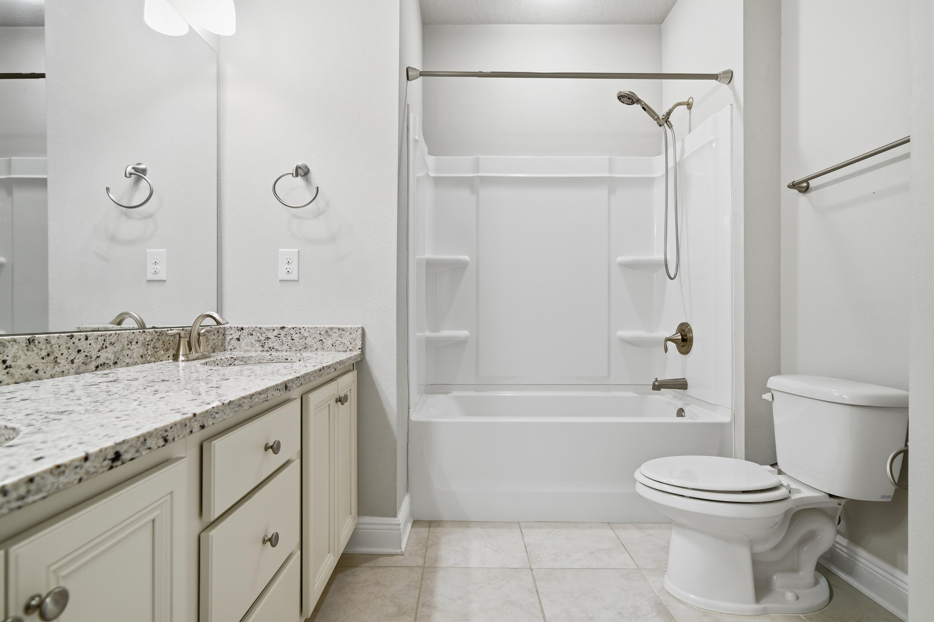 132 Wayne Trail Santa Rosa Beach, FL 32459 - Photo 31 of 43 a bathroom with a granite countertop sink a toilet and a bathtub