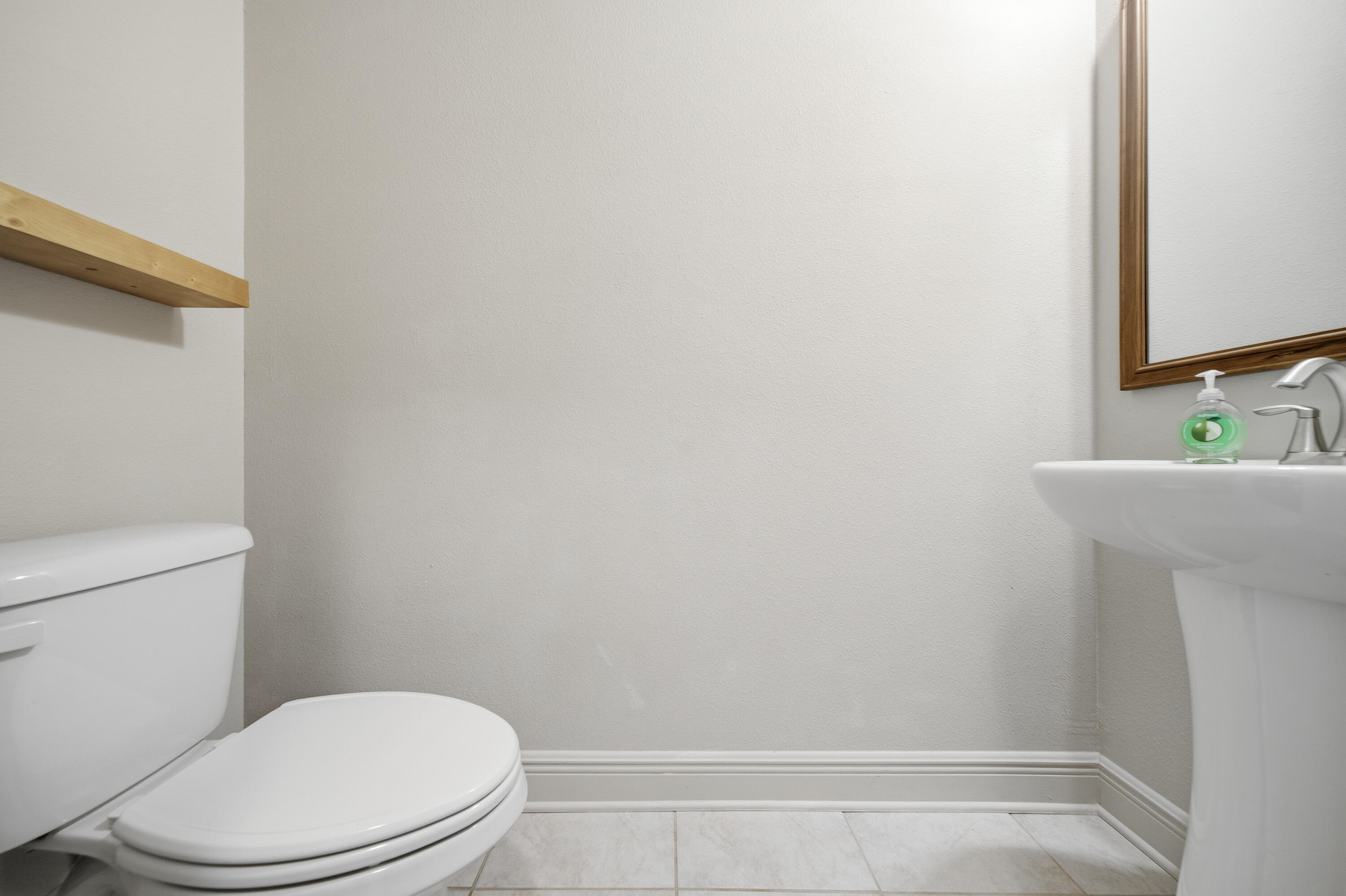 132 Wayne Trail Santa Rosa Beach, FL 32459 - Photo 35 of 43 a white toilet sitting next to a bathroom sink